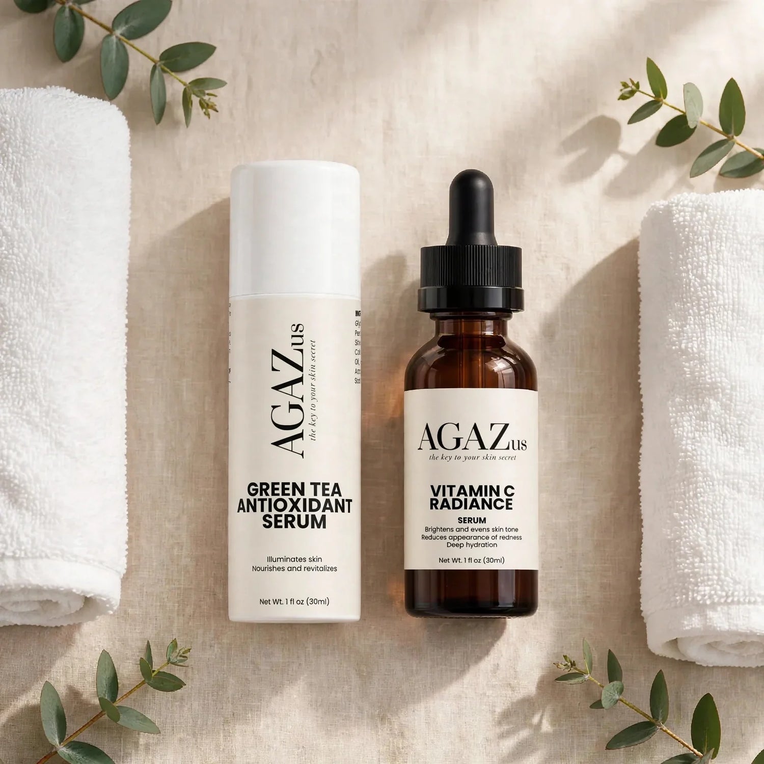 AGAZus Clinical Serum Collection – Green Tea Antioxidant Serum and Vitamin C Radiance Serum for brightening and sensitive skin, flatlay on beige linen with white towels